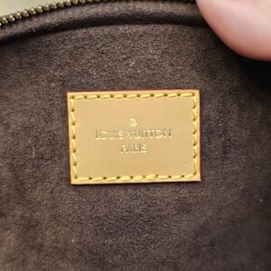 Interior leather patch stamped LOUIS VUITTON PARIS