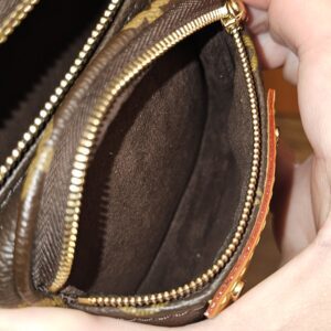 Front zip pocket held open showing the clean lining