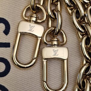 Close up of the chain clasps engraved with the LV logo
