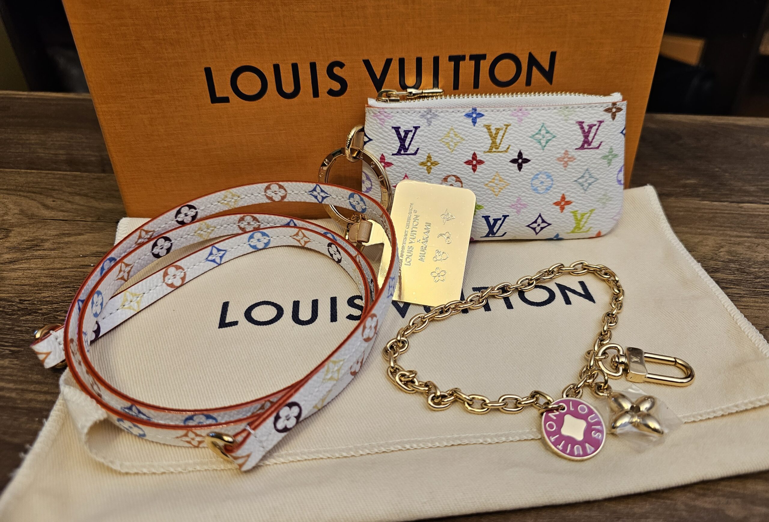Louis Vuitton x Takashi Murakami Monogram Multicolor Phone Holder White - shown with its strap, charm chain and box
