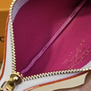 Zip open showing the bright pink interior