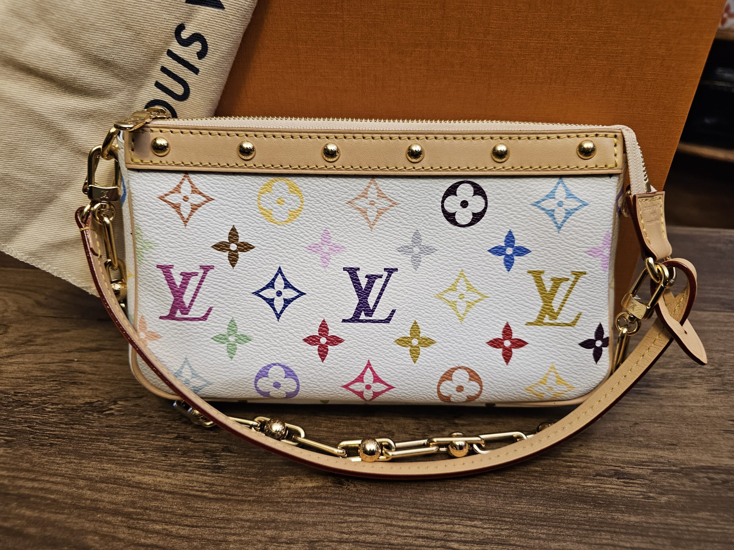 Front view with the leather strap and gold-tone chain