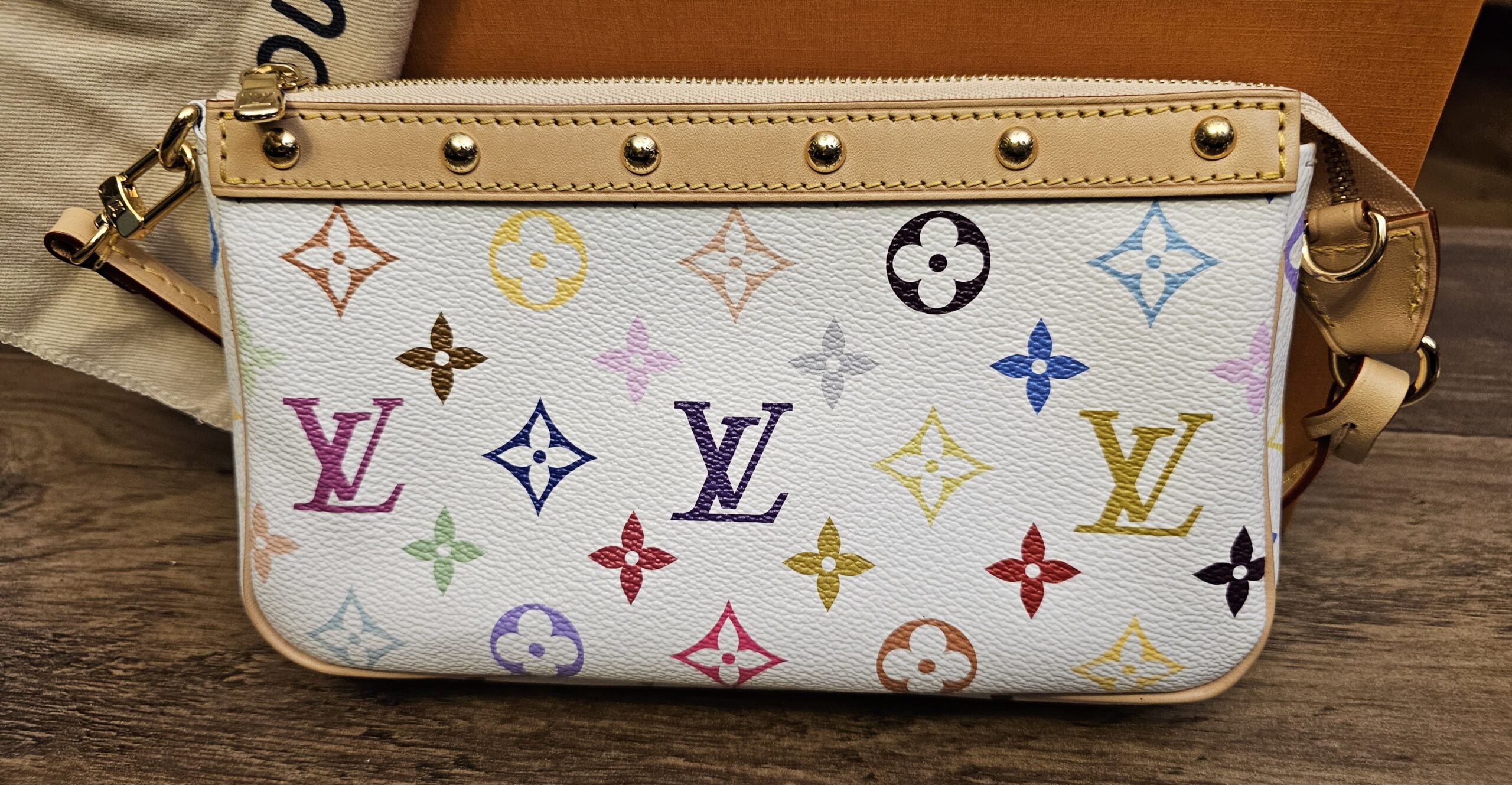 Front of the pochette showing the studded leather trim