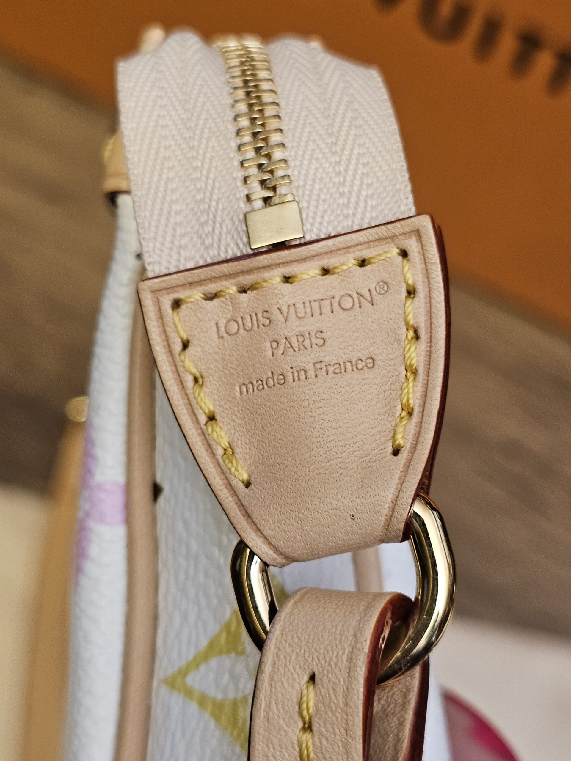 Leather strap tab stamped LOUIS VUITTON PARIS made in France