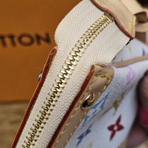Side of the zip showing the leather tab and stud