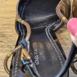 Footbed held open showing the stamp and wear