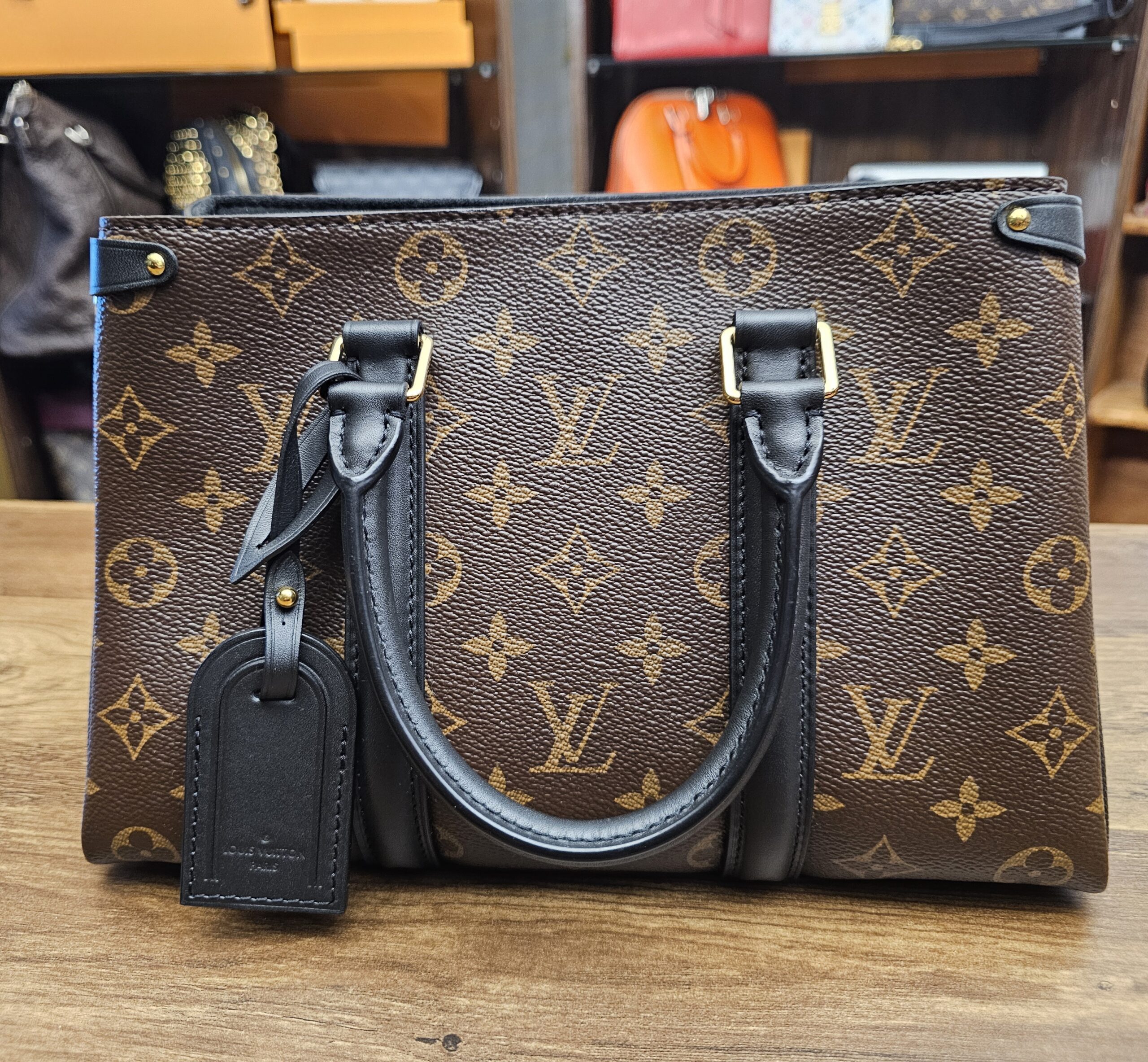 Back of the bag with the luggage tag at one handle