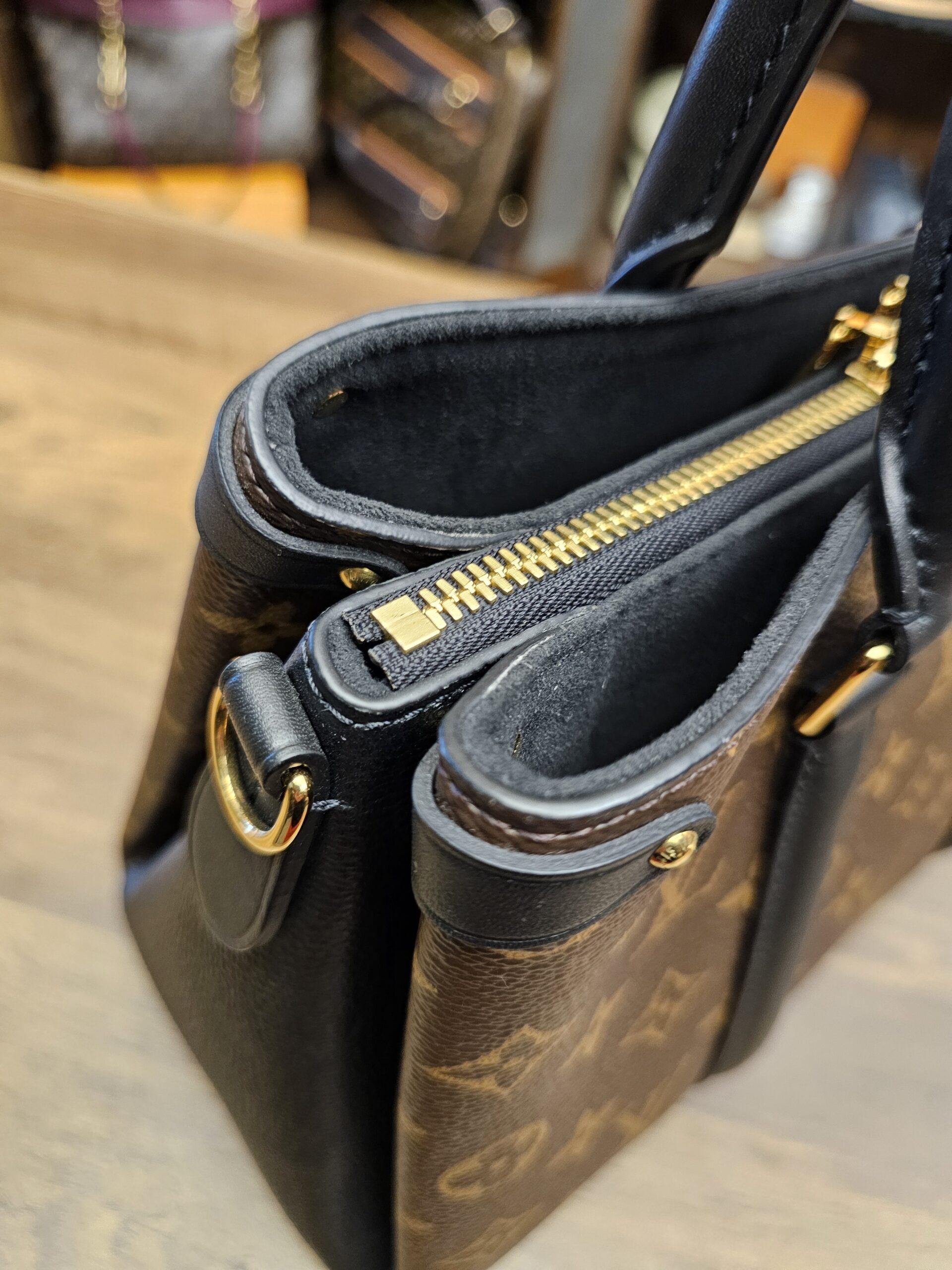 Angled view of the top with the side compartments open