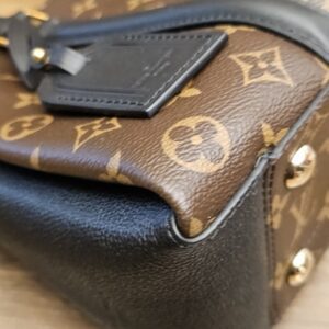 Corner of the bag beside the luggage tag
