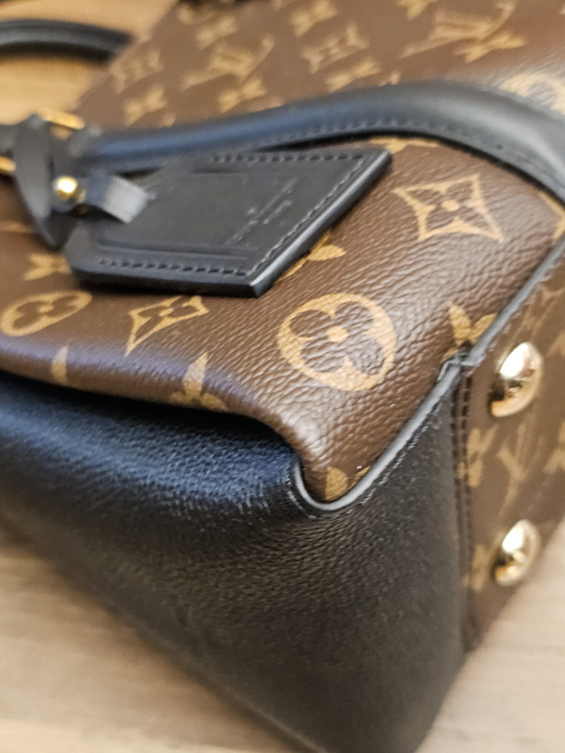 Corner of the bag beside the luggage tag
