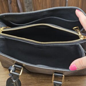 Interior with the zipped center pocket open
