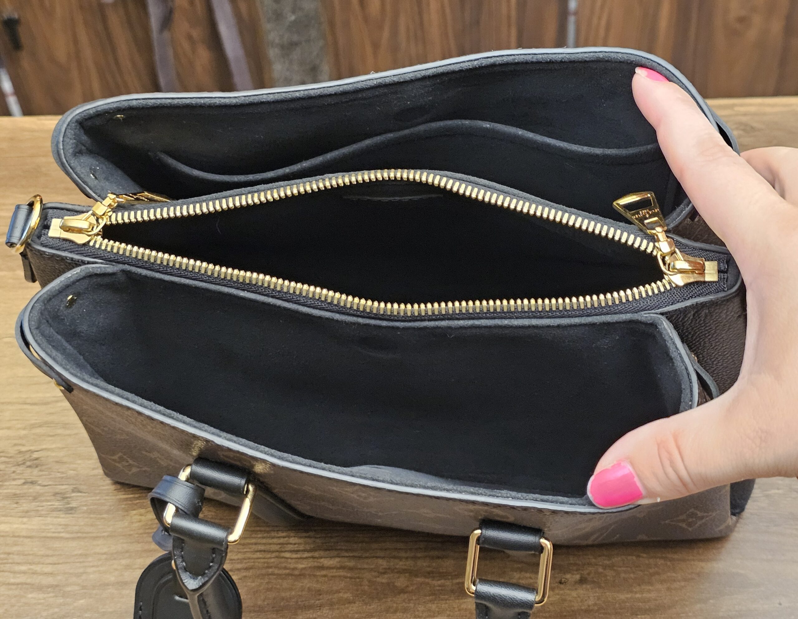 Interior with the zipped center pocket open