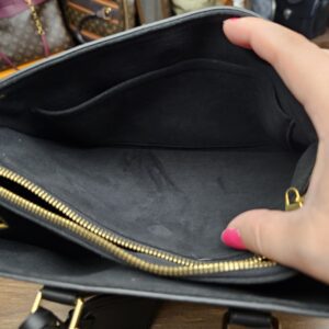 Inside a side compartment showing the black lining