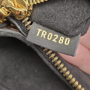Date code TR0280 on a leather tab inside the bag