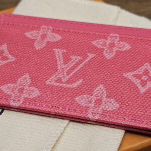 Angled view of the pink Monogram canvas