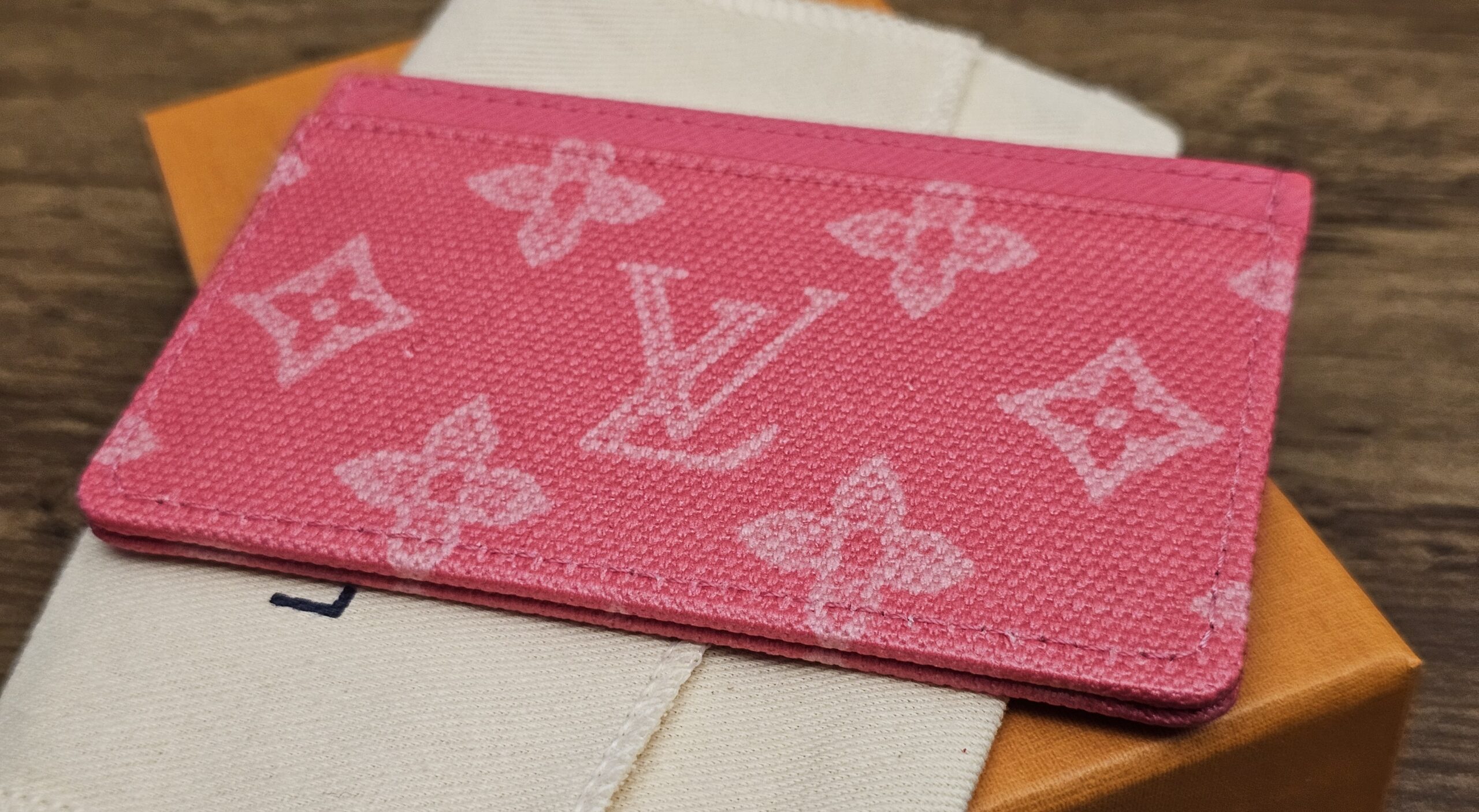 Angled view of the pink Monogram canvas