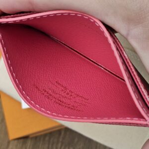Center pocket held open showing the pink leather lining