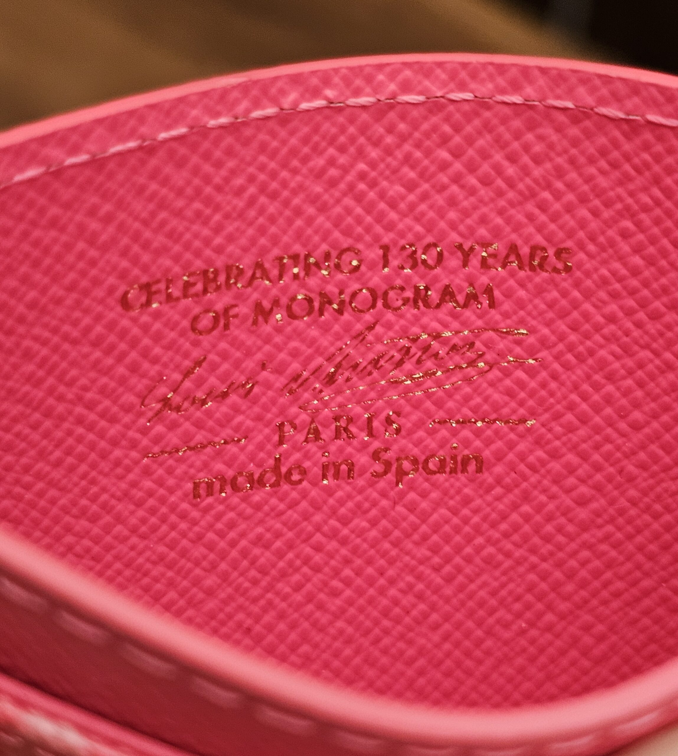 Inside stamp reading Celebrating 130 Years of Monogram, Louis Vuitton Paris, made in Spain