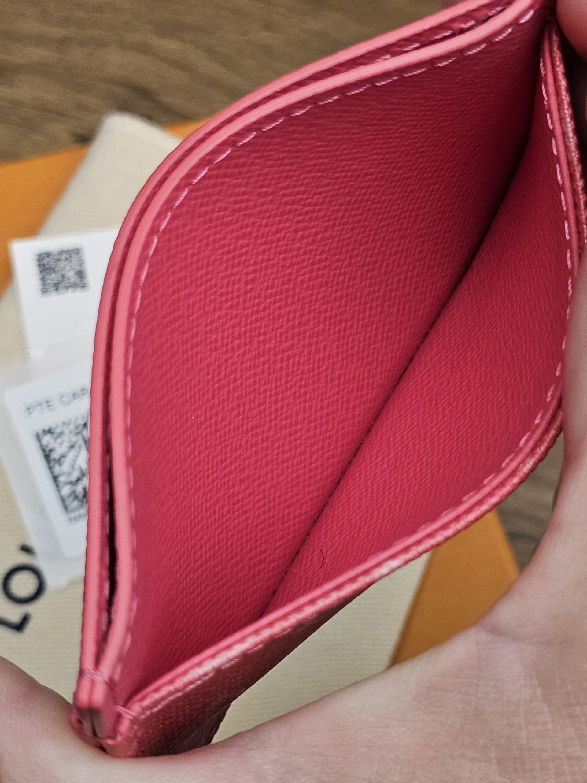 Center pocket opened wide with clean pink leather