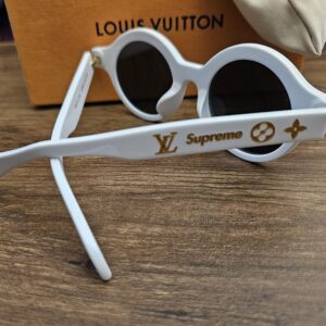 Other side showing the LV and Supreme logos on the temple