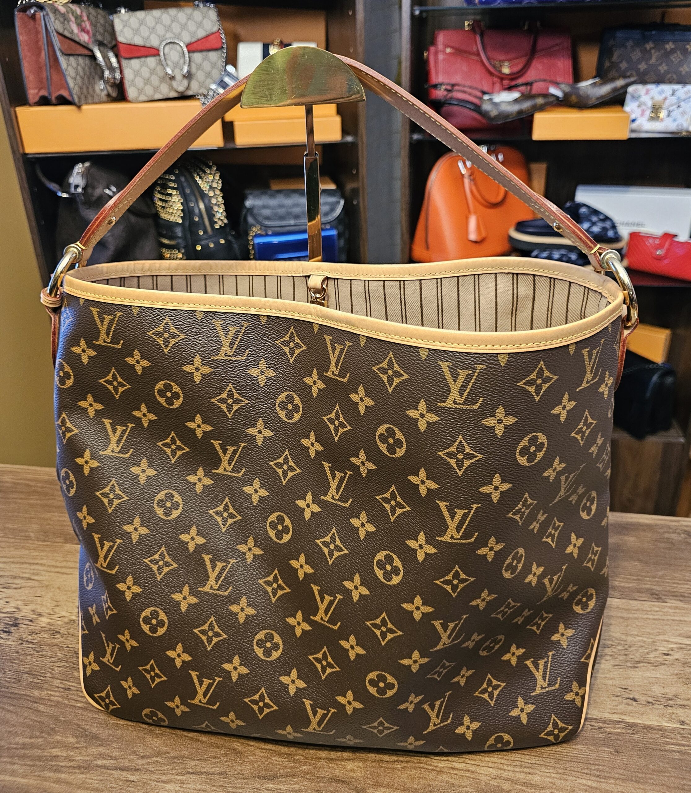 Louis Vuitton Monogram Delightful MM - front view with the vachetta shoulder strap and gold-tone hardware