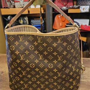 Back of the bag in Monogram canvas with the strap up