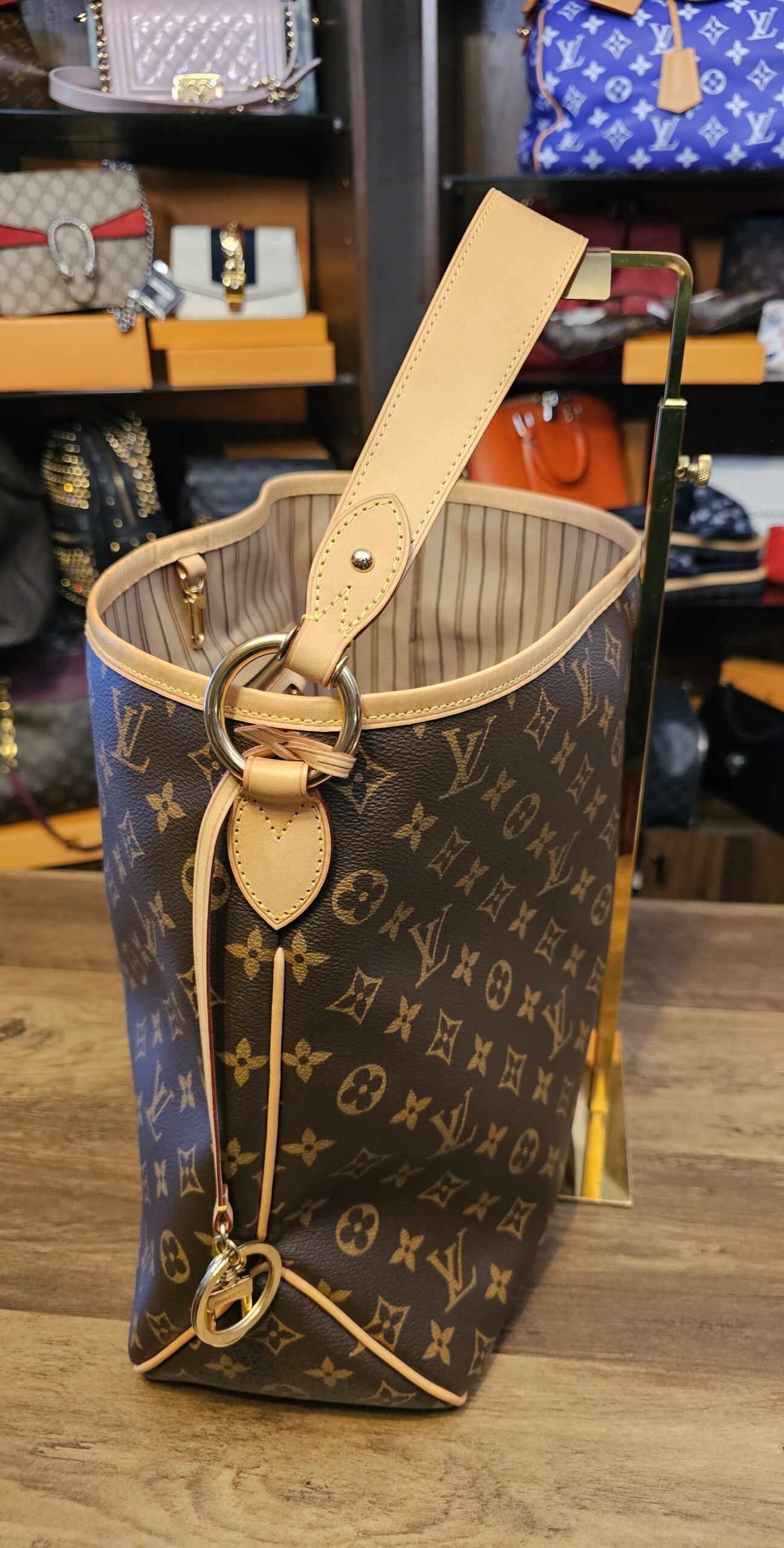 Side view with the ring and vachetta tab that cinches the bag