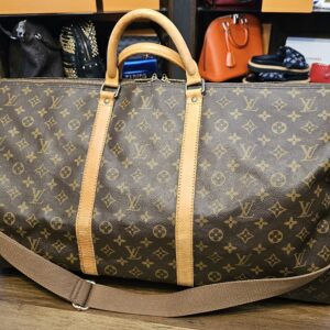 Louis Vuitton Monogram Keepall Bandouliere 60 - front view with rolled handles and the shoulder strap