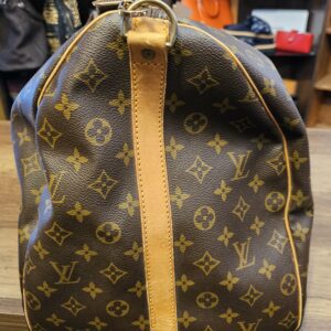 End of the bag with the vachetta trim and D ring