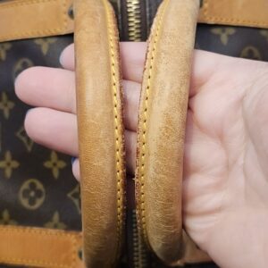 Rolled leather handles showing age-related wear