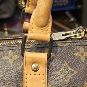 Handle attachment with the brass ring and stud