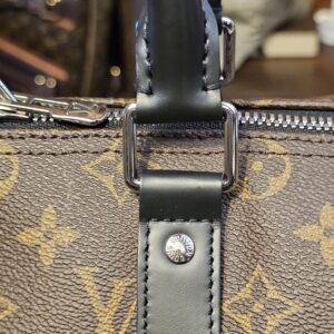 Handle attachment with silver-tone ring and stud