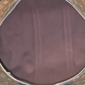 Open bag showing the burgundy textile interior
