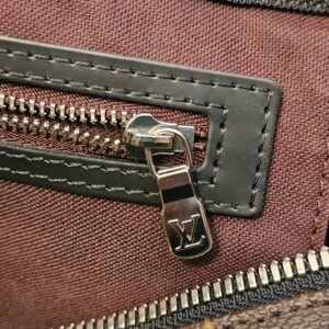 Interior zip pocket with leather trim