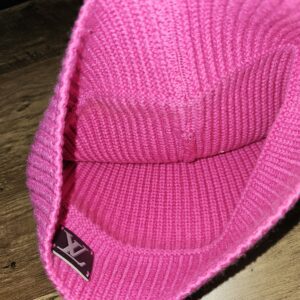 Inside the beanie showing the inner knit and logo patch