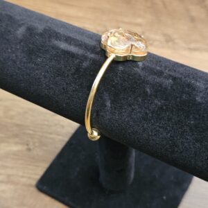 Side view of the open cuff on the stand