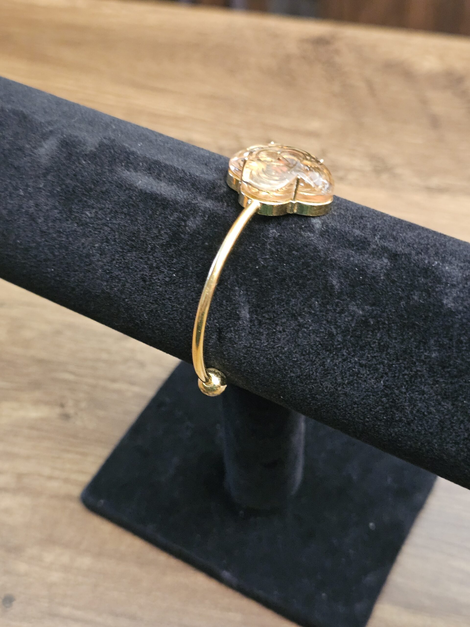 Side view of the open cuff on the stand