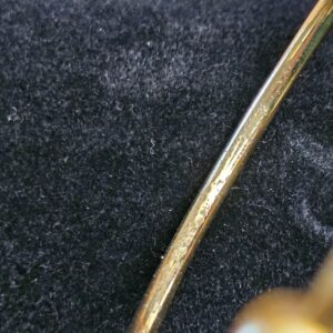Cuff band showing scratches and finish wear