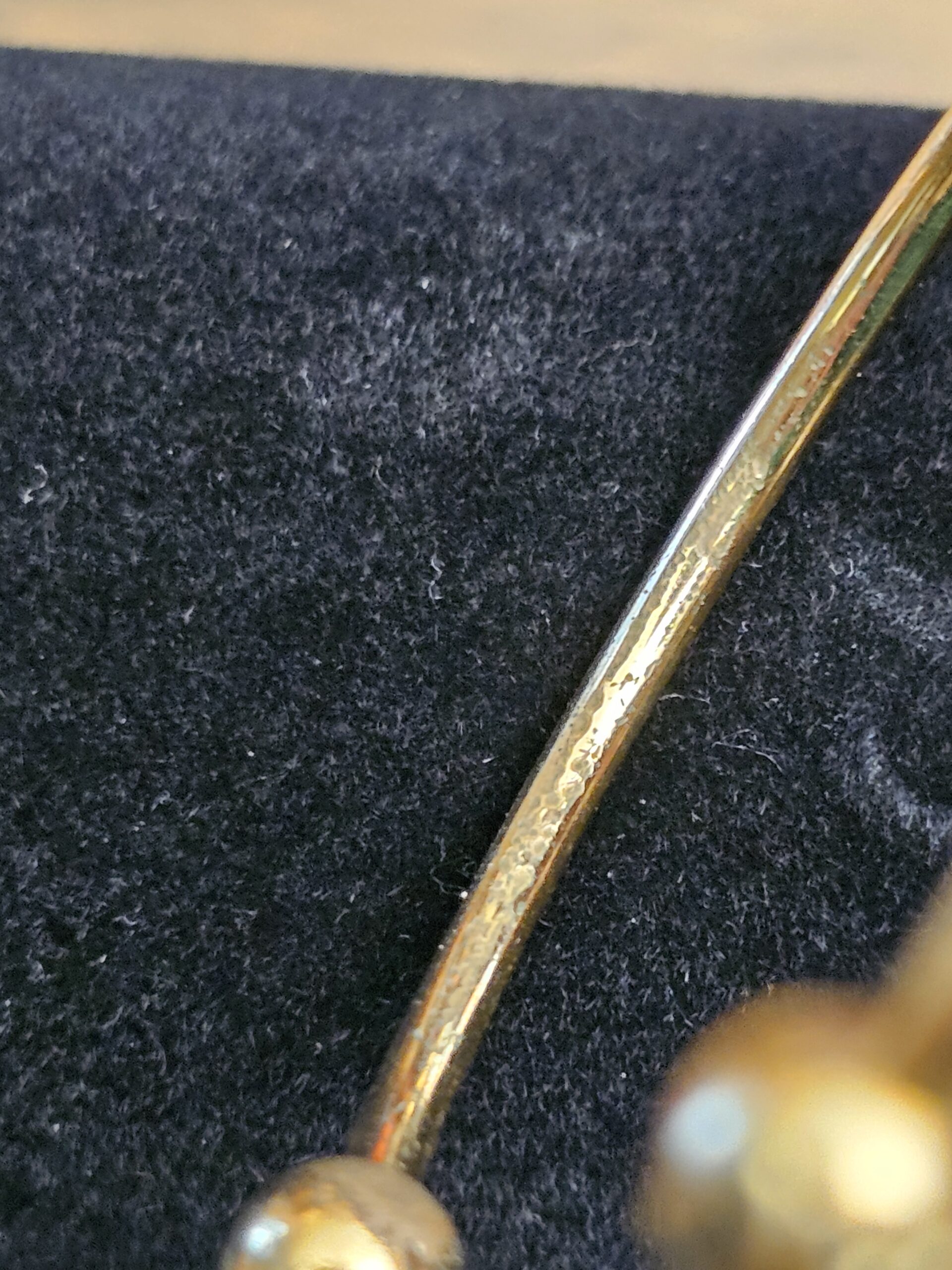 Cuff band showing scratches and finish wear
