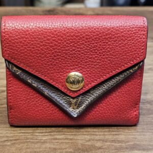 Louis Vuitton Monogram Double V Compact Wallet Red - front view of the red leather V flap over Monogram canvas with the LV snap