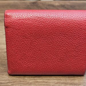 Back of the wallet in red grained leather