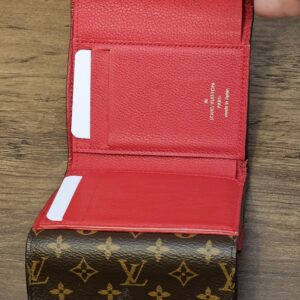 Wallet opened with card slots and the Monogram canvas flap