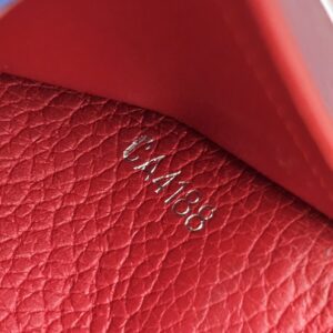 Date code CA4188 stamped in the red leather