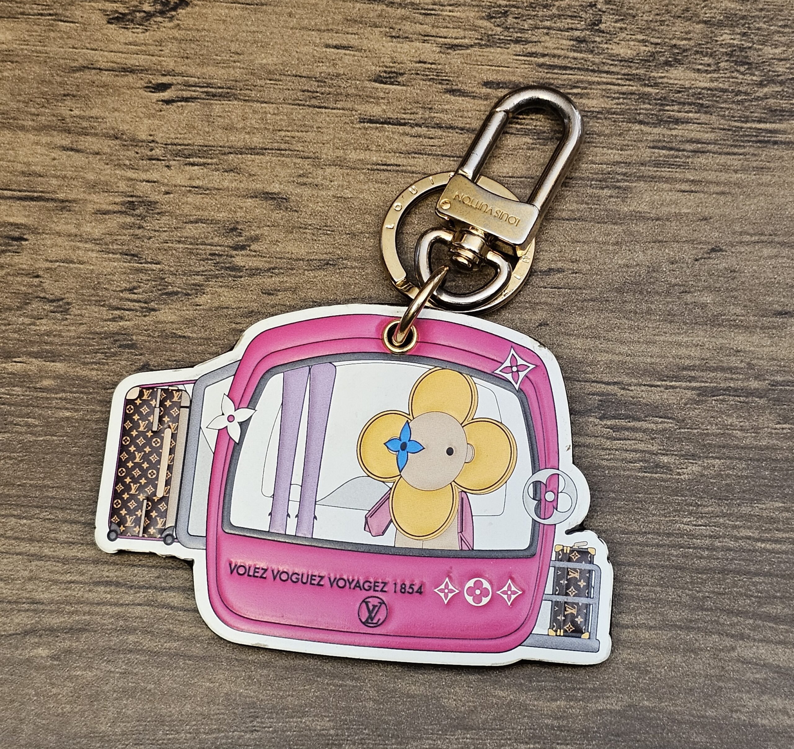 Louis Vuitton Vivienne 2019 Christmas Key Holder and Bag Charm Pink - front of the pink Vivienne travel artwork with key ring and clasp