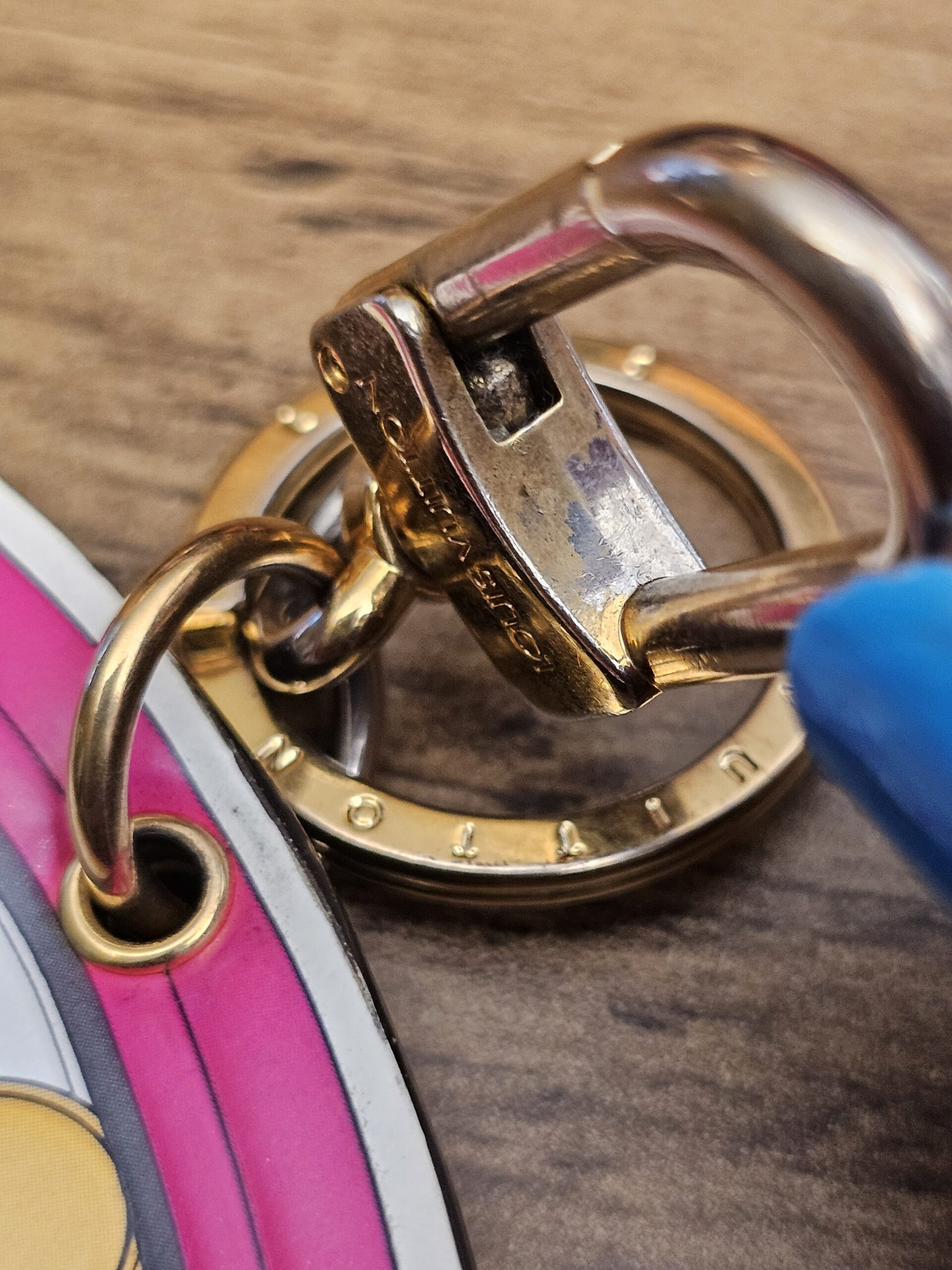 Swivel clasp hinge showing scratches and discoloration