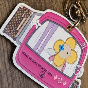 Front of the charm at an angle showing the artwork edges