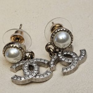 Close up of the faux pearls and crystal-set CC logos