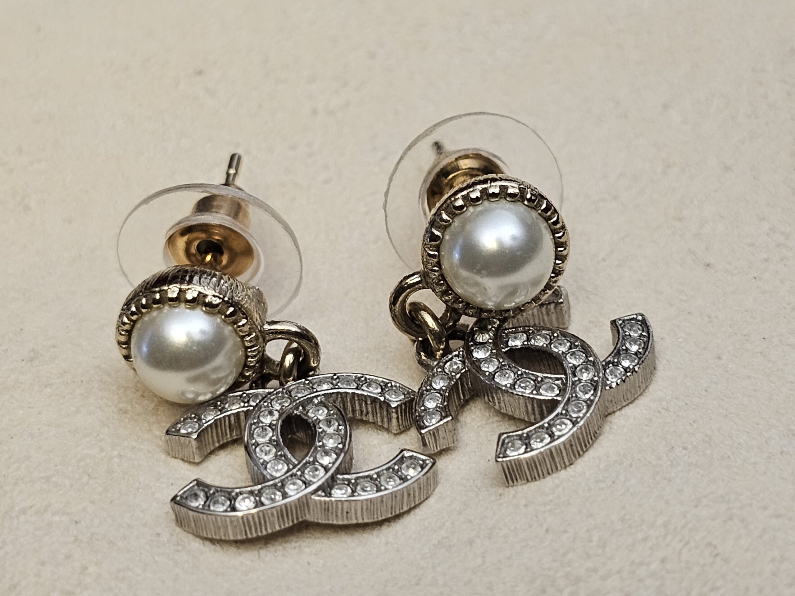 Close up of the faux pearls and crystal-set CC logos
