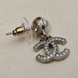 Side view of one earring with its post and back