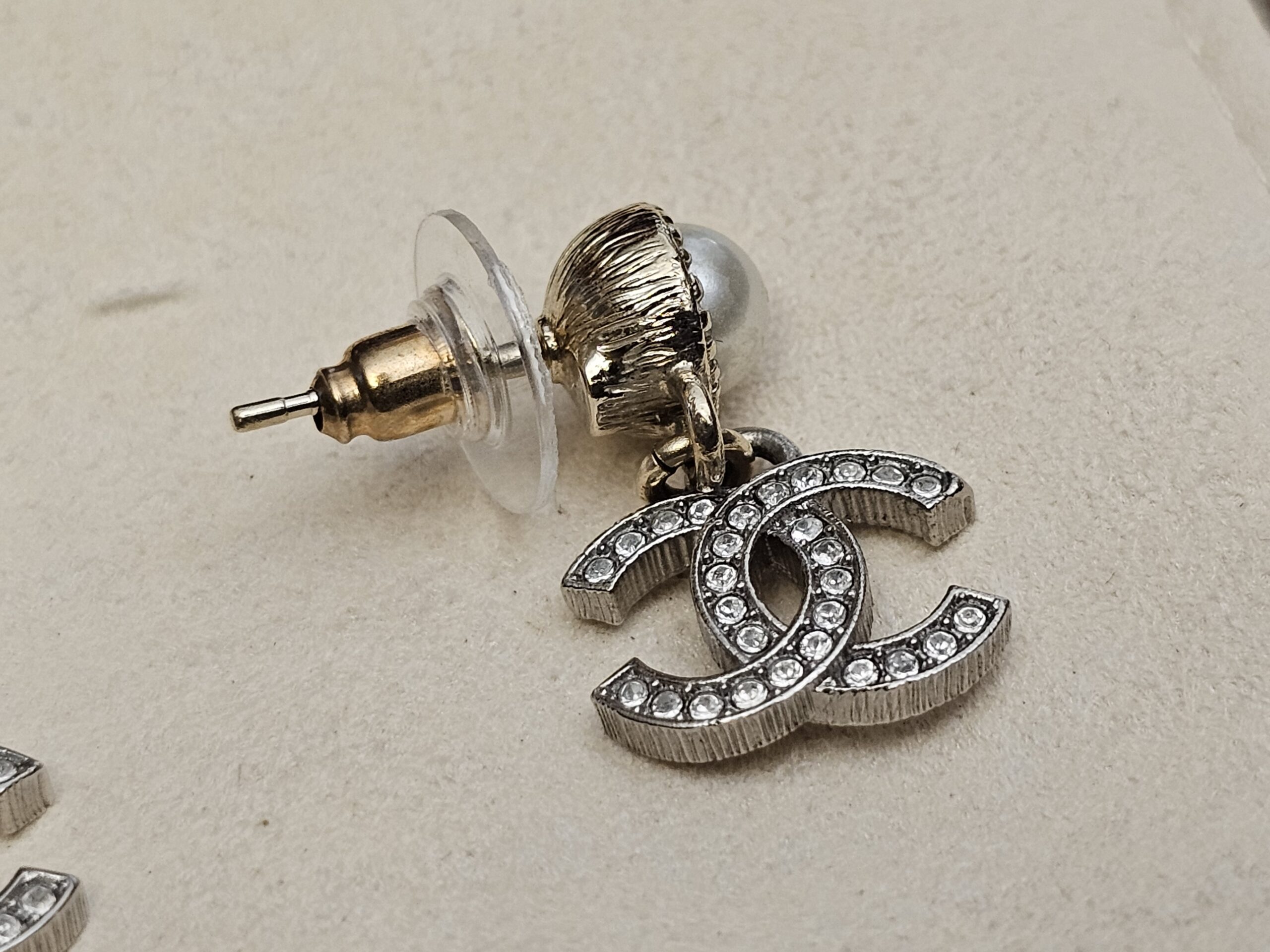 Side view of one earring with its post and back